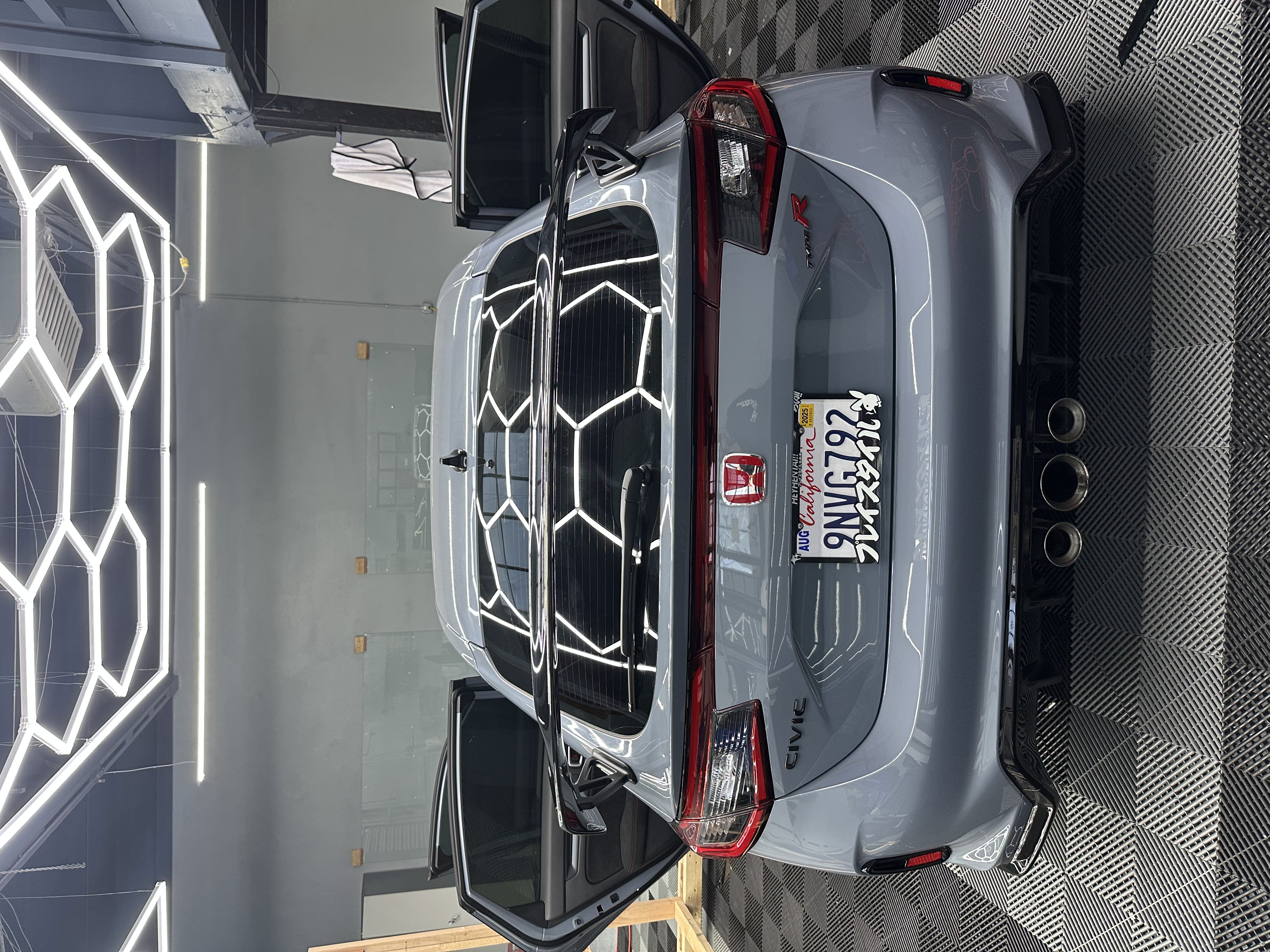 Black SUV under ceiling lights